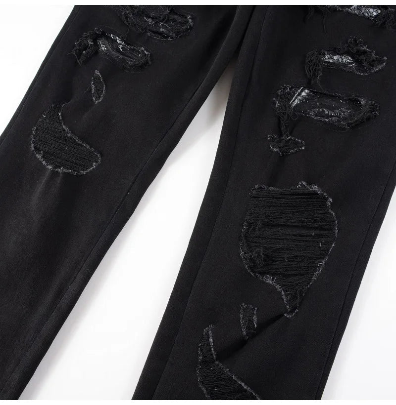 Nofacebaby Black Snake Jeans showcasing ripped knee details with a hidden snake print, marrying destruction with design.