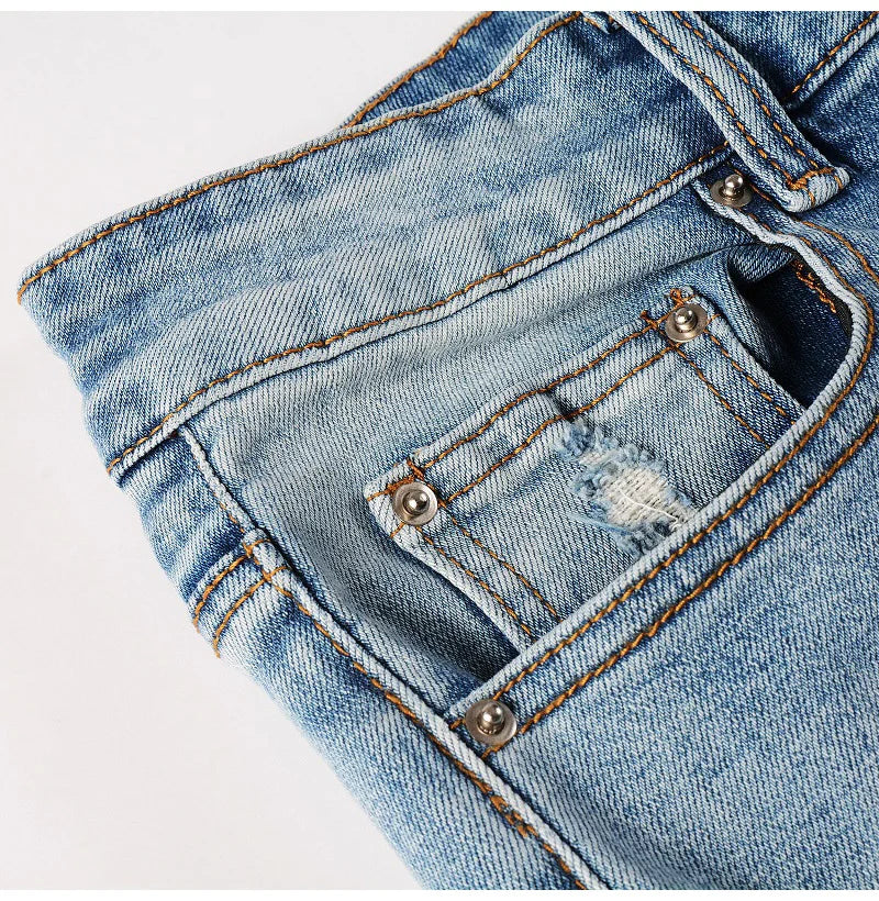 Close-up of Nofacebaby C2 jeans' front pocket with subtle Swarovski crystal embellishments.