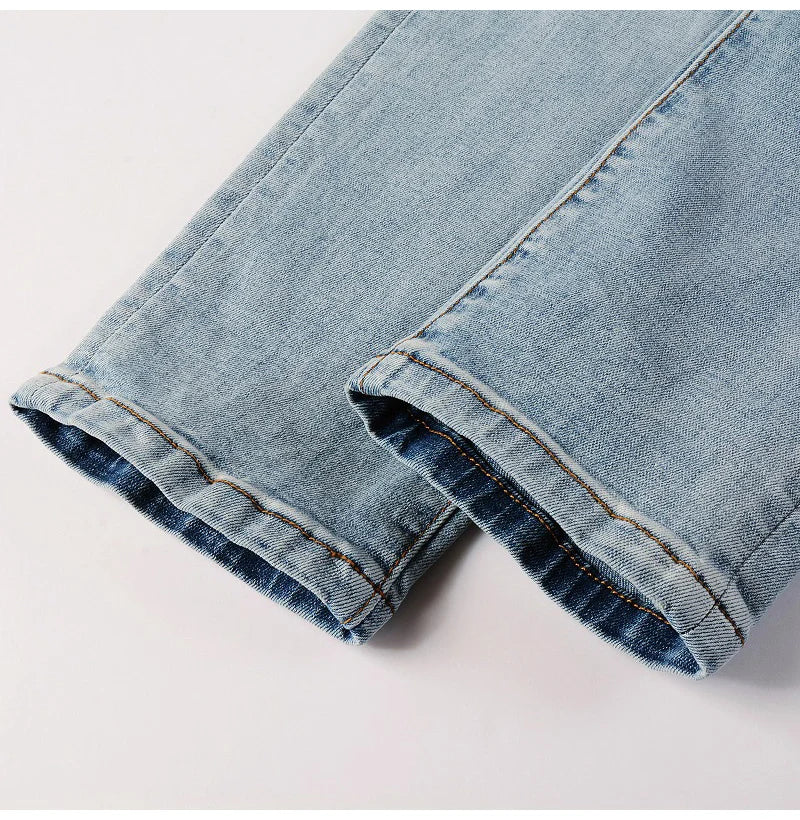 Detailed leg view of Nofacebaby C2 jeans showcasing the scattered blue Swarovski crystals.