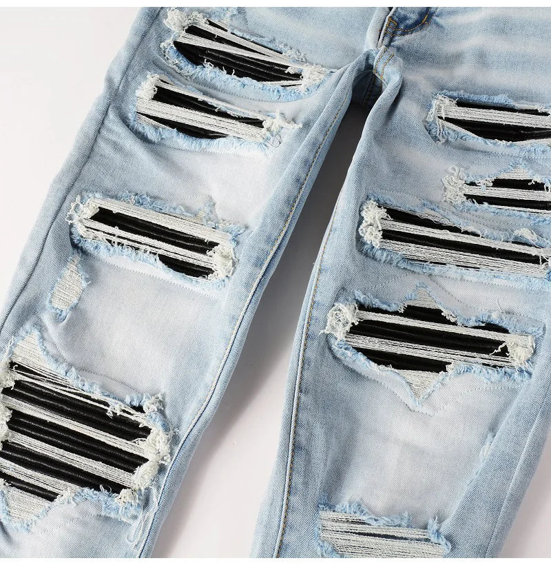 mage focusing on the ripped details of the Nofacebaby EMSS Jeans, featuring frayed edges and the robust texture of Italian denim.