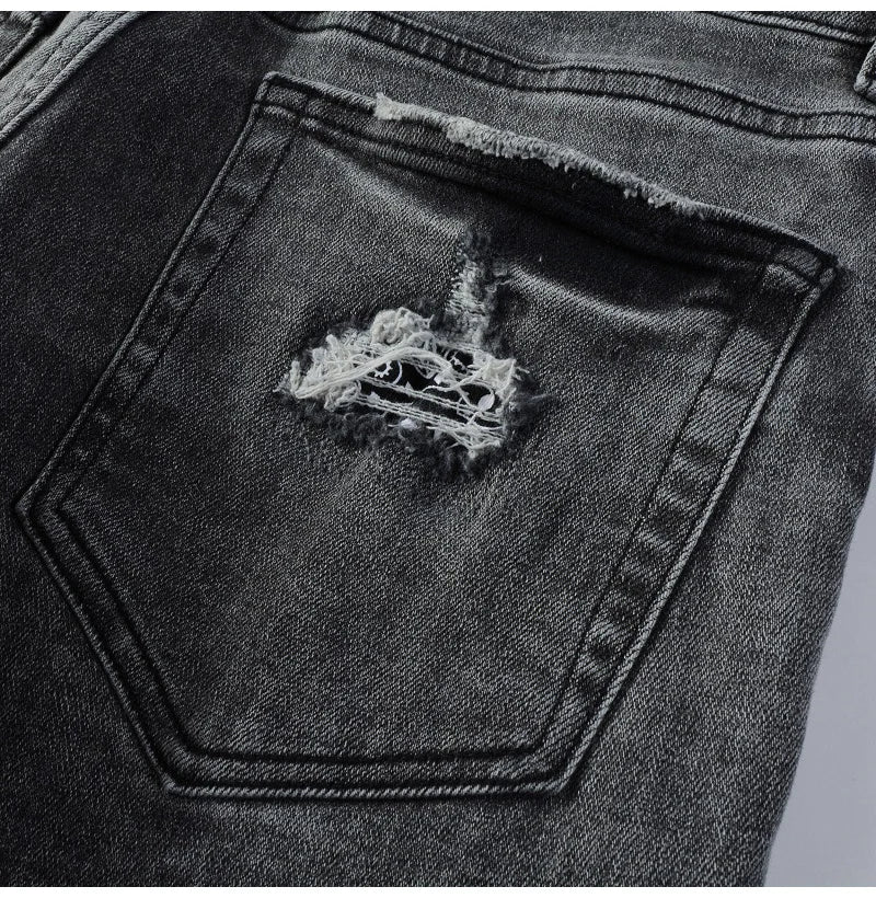 Zoomed-in view of the back pocket on Nofacebaby G2 Jeans with frayed edges and subtle branding.