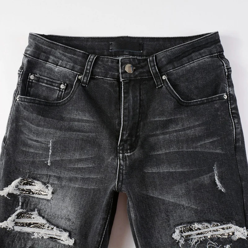 Front view of Nofacebaby Grey Skinny Jeans highlighting the faded wash and distressed rips along the thighs and knees.