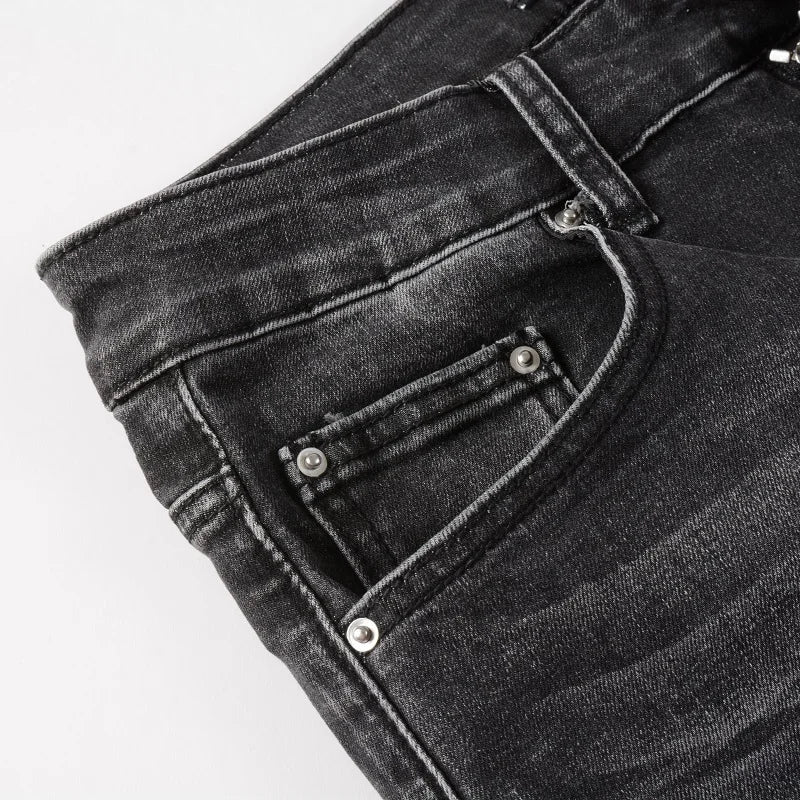 Pocket detail of Nofacebaby Gray Skinny Jeans highlighting the label and refined stitching.