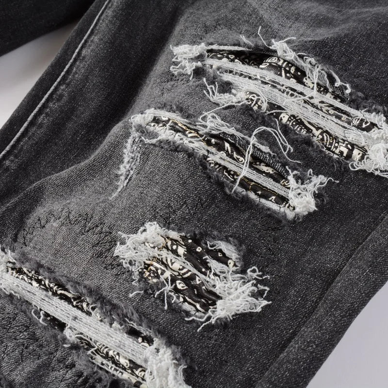 Detailed shot of the Nofacebaby Gray Skinny Jeans' rips and distressed areas, adding texture and urban flair.