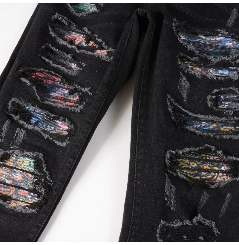 Nofacebaby M31 jeans, intricate rip design revealing multicolor fabric.