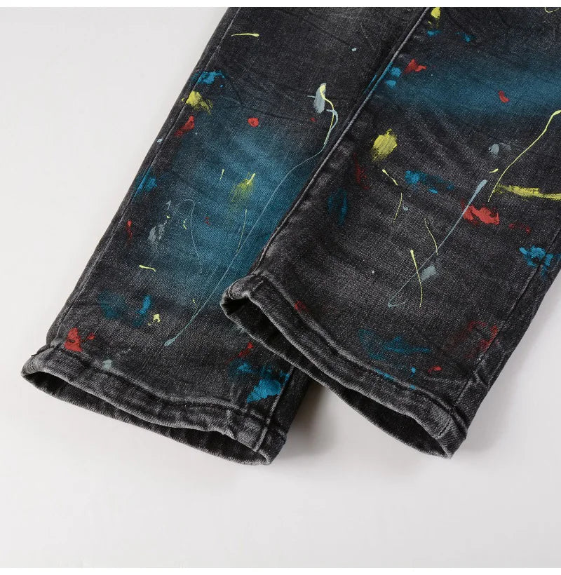 Nofacebaby M33 Jeans with colorful paint details on the hem.