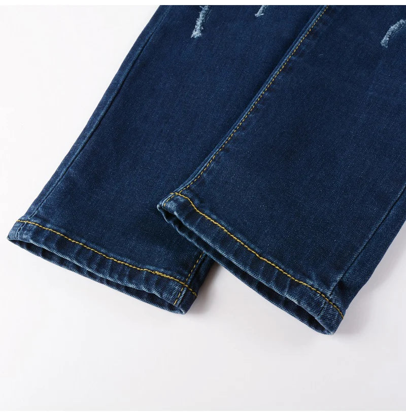 Close-up of the lower leg details on Nofacebaby M8 Jeans, crafted from premium Italian denim.
