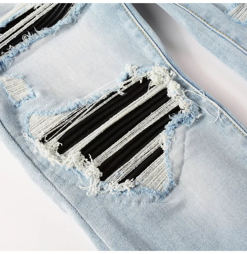 Close view of the knee details on Nofacebaby EMSS Jeans, displaying intricate distressing and the durability of Italian denim.