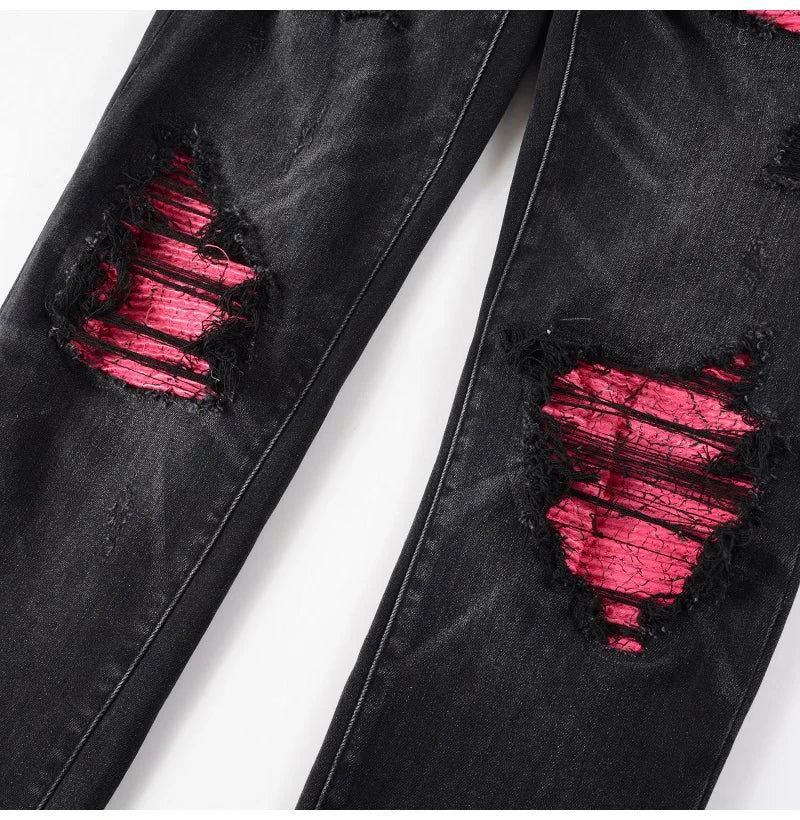 Detailed view of the pink ripped knee accents on Nofacebaby Rose Skinny Jeans, showcasing the texture.