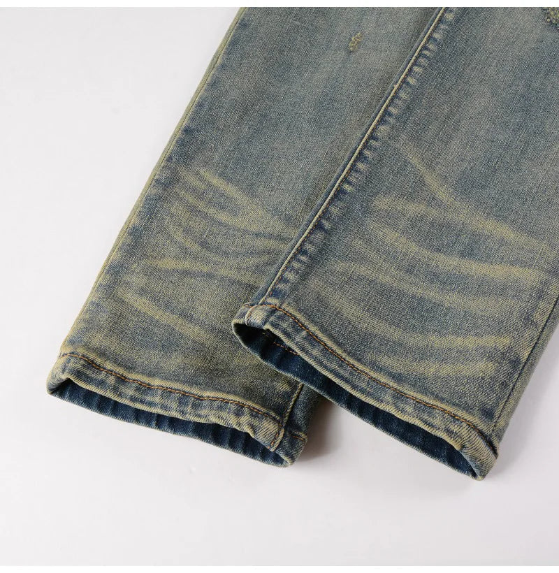 Leg detail of Nofacebaby Ynno Jeans with faded wash.