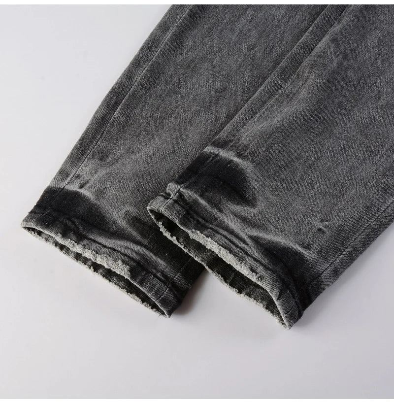 Nofacebaby G2 Jeans showcasing detailed leg wear and tear with patterned underpatches.