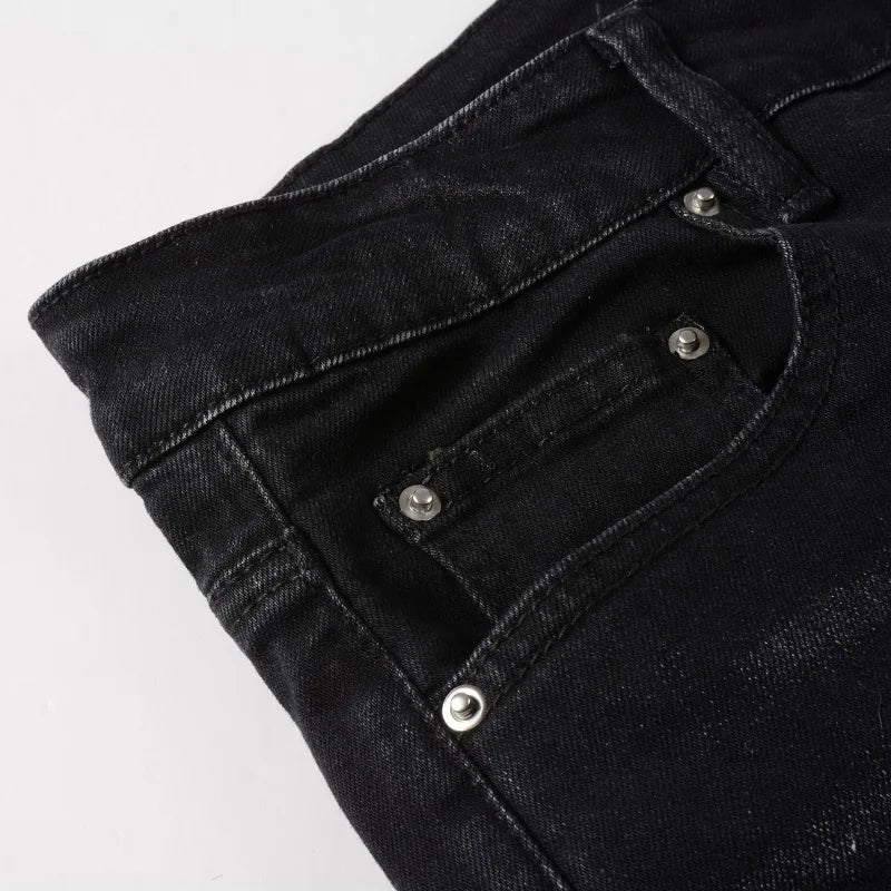 Front pocket detail of black Nofacebaby M21 Jeans.