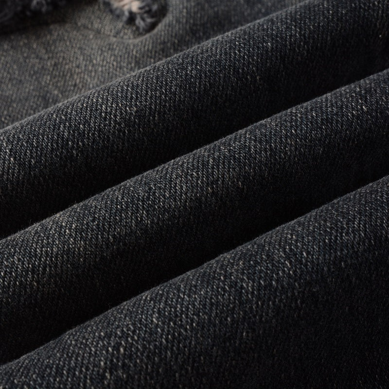 Texture-focused view of the black denim used in Nofacebaby S7 Jeans.