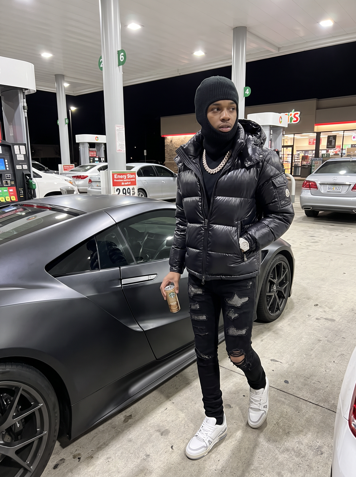NOFACEBABY Black Crystal King jeans at a gas station at night
